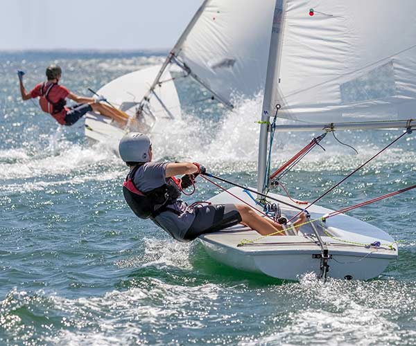 two single sailers in dinghies, racing against each other