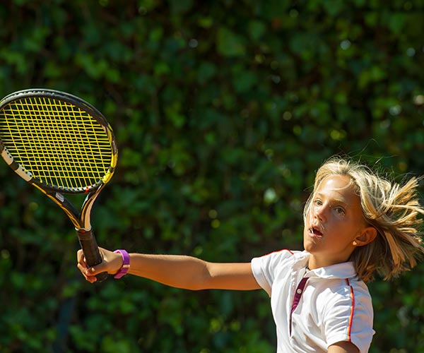 Young  female tennis player about to serve